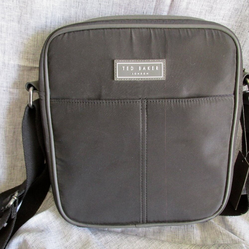 NWT- Ted Baker Vegan Flight Bag 2 front snap pockets one zip compartment